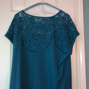 Blue blouse with sheer neckline